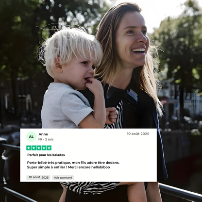 Parent utilisant le porte-bébé ergonomique HelloBiboo pour une balade avec son enfant